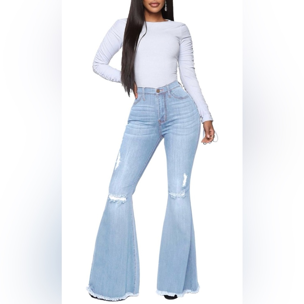Women's Distressed Bell Bottom Jeans 
Small. Light Wash